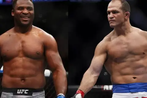 Francis Ngannou i Junior dos Santos, dwaj potężni wojownicy MMA, gotowi do walki.