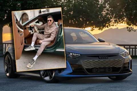 Robert Lewandowski w stylowym dresie i modnych sneakersach pozuje przy luksusowym samochodzie. To jedne z jego wymarzonych samochodów.